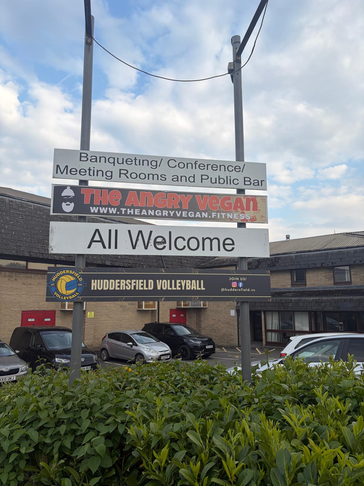 Exterior sign at Sikh Leisure Centre where Huddersfield Volleyball Club sessions take place.